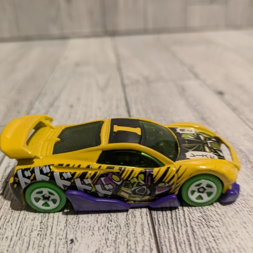 hot Wheels Yellow Graphic Racing Toy Car with Green Wheels